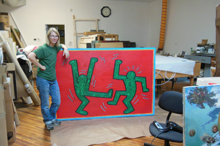 Christyl Cusworth in the studio with artwork